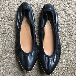 Leather black flats with gold trim